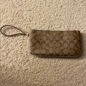 Coach wristlet, minor mark in picture